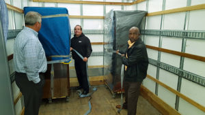 From the classroom into the truck—crew members got hands-on training learning the IOMI® floating method of keeping the furniture on the dolly on the floor of the truck.